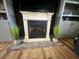 Living room fireplace with light stone surround and tile hearth at 1173 Penny Creek Dr, Ruffin, SC 29475