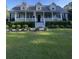 Charming house with a covered front porch, dormer windows, and well-maintained landscaping at 1173 Penny Creek Dr, Ruffin, SC 29475