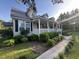 Inviting house featuring a charming porch, dormer windows, and manicured front yard at 1173 Penny Creek Dr, Ruffin, SC 29475