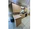 Kitchen with lots of light wood cabinets and black appliances at 1173 Penny Creek Dr, Ruffin, SC 29475