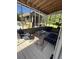 Cozy screened porch with comfortable seating, colorful rug, and bar in view at 1173 Penny Creek Dr, Ruffin, SC 29475