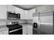 Modern kitchen featuring white cabinets, stainless steel appliances, and granite countertops at 143 Haventree Ct, Summerville, SC 29486