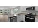 Bright kitchen featuring white cabinets, granite countertops, and stainless steel appliances at 143 Haventree Ct, Summerville, SC 29486