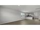 Bright open floor plan with white walls, wood flooring, and eat-in kitchen at 143 Haventree Ct, Summerville, SC 29486