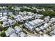 Beautiful aerial view of a coastal neighborhood showcasing stylish white homes with well-manicured landscaping at 1466 Mizzen Aly, Johns Island, SC 29455