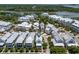Stunning aerial view of a neighborhood featuring charming white homes with metal roofs near a scenic waterway at 1466 Mizzen Aly, Johns Island, SC 29455