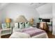Cozy bedroom with patterned headboard, desk, and ample natural light at 1466 Mizzen Aly, Johns Island, SC 29455