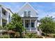 Charming two-story white home boasting a welcoming porch and fresh landscaping at 1466 Mizzen Aly, Johns Island, SC 29455