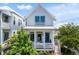 Attractive home featuring a cozy porch, vibrant blue door, and bright white exterior at 1466 Mizzen Aly, Johns Island, SC 29455