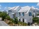 Elegant neighborhood featuring white siding, blue shutters, and pristine landscaping at 1466 Mizzen Aly, Johns Island, SC 29455