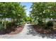 Picturesque path featuring a serene water feature and lush landscaping leading to the homes at 1466 Mizzen Aly, Johns Island, SC 29455