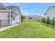 Well-maintained backyard offers ample space with a black metal fence, providing security and defined property lines at 1601 Bourne Xing, Mount Pleasant, SC 29466