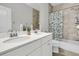 Bright bathroom features double vanity with quartz countertops, and tiled shower/tub at 1601 Bourne Xing, Mount Pleasant, SC 29466
