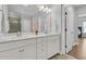 Bright bathroom featuring double vanity, quartz countertops, and decorative flower accent at 1601 Bourne Xing, Mount Pleasant, SC 29466