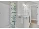 Bright bathroom with a walk-in shower, light gray walls, and a door to the Primary closet at 1601 Bourne Xing, Mount Pleasant, SC 29466