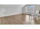 Spacious bedroom with light gray walls, hardwood floors, natural light, and a small desk at 1601 Bourne Xing, Mount Pleasant, SC 29466