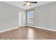 Bright bedroom with hardwood floors, light gray walls, natural light, and a ceiling fan at 1601 Bourne Xing, Mount Pleasant, SC 29466