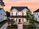 Beautiful exterior elevation showcasing the home's architectural details, inviting front porch, and well-kept landscaping at 1601 Bourne Xing, Mount Pleasant, SC 29466