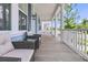 Inviting front porch with seating, stylish railings, beautiful columns, and a street view at 1601 Bourne Xing, Mount Pleasant, SC 29466