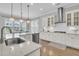 Bright, modern kitchen featuring white cabinetry, stainless steel appliances, and a spacious island with pendant lighting at 1601 Bourne Xing, Mount Pleasant, SC 29466
