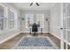 Well-lit home office with large windows, providing a comfortable and productive workspace at 1601 Bourne Xing, Mount Pleasant, SC 29466