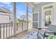 Relaxing screened porch features neutral decor and a view of the landscaped backyard, creating a serene outdoor retreat at 1601 Bourne Xing, Mount Pleasant, SC 29466
