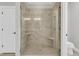 Walk in shower with stylish tile, a glass door, and built in corner shelves at 1601 Bourne Xing, Mount Pleasant, SC 29466