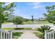 Scenic view of the neighborhood street and pond from the front porch of the home at 1601 Bourne Xing, Mount Pleasant, SC 29466