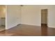 Cozy bedroom featuring hardwood floors and a view into an adjacent bathroom and closet at 171 Threaded Fern Lndg, Summerville, SC 29485