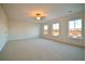 Spacious bedroom featuring neutral carpeting and three windows offering natural light at 171 Threaded Fern Lndg, Summerville, SC 29485