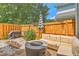 Private fenced-in backyard with outdoor seating and fire pit at 1723 Brittlebush Ln, Johns Island, SC 29455
