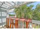 Outdoor balcony with wooden floors, railing, string lights, and a bar at 1723 Brittlebush Ln, Johns Island, SC 29455