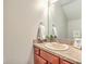 Half bathroom features a vanity, mirror, neutral paint and modern fixtures at 1723 Brittlebush Ln, Johns Island, SC 29455