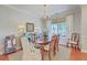 Formal dining room featuring hardwood floors, elegant chandelier, and a classic dining set at 1723 Brittlebush Ln, Johns Island, SC 29455