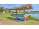 Community kayak rack with several kayaks stored on it with lake access, a fun amenity for outdoor enthusiasts at 1723 Brittlebush Ln, Johns Island, SC 29455