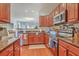Well-equipped kitchen with stainless steel appliances, granite countertops, and hardwood floors at 1723 Brittlebush Ln, Johns Island, SC 29455