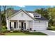 Attractive single-Gathering home featuring a covered porch, gray roof and two-car garage at 173 Threaded Fern Lndg, Summerville, SC 29485