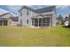 This home features a spacious backyard, complete with a screened porch and a fire pit area at 175 Threaded Fern Lndg, Summerville, SC 29485