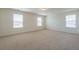 Bedroom features neutral carpet, three windows, and ample natural light at 175 Threaded Fern Lndg, Summerville, SC 29485