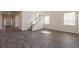 Open entryway and Gathering room with hardwood flooring, staircase, and natural light at 175 Threaded Fern Lndg, Summerville, SC 29485