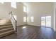 Bright living room featuring tall windows, staircase and sliding glass doors to the backyard at 175 Threaded Fern Lndg, Summerville, SC 29485
