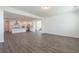 Open concept living room showcasing the white kitchen, island, stainless steel appliances at 175 Threaded Fern Lndg, Summerville, SC 29485
