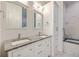 Elegant bathroom with double sinks, granite countertop, modern fixtures, and luxurious bathtub at 200 River Landing Dr # 307B, Charleston, SC 29492
