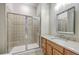 Bathroom featuring a glass-enclosed shower, modern vanity, and neutral tile at 200 River Landing Dr # 307B, Charleston, SC 29492