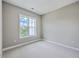 Sunlit bedroom with neutral walls and a large window providing plenty of natural light at 200 River Landing Dr # 307B, Charleston, SC 29492