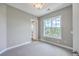 Cozy bedroom filled with natural light, showcasing neutral walls and a large window at 200 River Landing Dr # 307B, Charleston, SC 29492