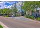Attractive condominium building with well-maintained landscaping and convenient parking spaces at 200 River Landing Dr # 307B, Charleston, SC 29492