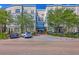 Attractive condo building featuring brick accents, meticulous landscaping, and convenient parking at 200 River Landing Dr # 307B, Charleston, SC 29492