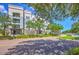 Beautiful condo exterior view highlighting manicured lawns, mature trees, and inviting community atmosphere at 200 River Landing Dr # 307B, Charleston, SC 29492