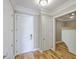 Bright hallway with wood floors, fresh paint, and elegant trim at 200 River Landing Dr # 307B, Charleston, SC 29492